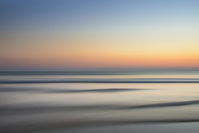 calm sea under golden clouds