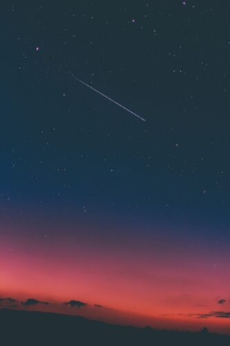 shooting star in night sky